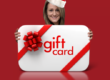 Barbara holding a Gift Card