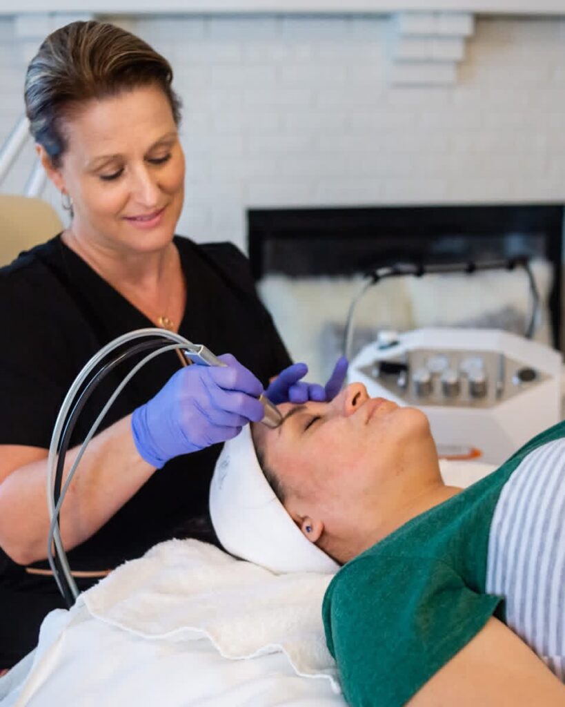 Barbara performing Advanced Microdermabrasion.